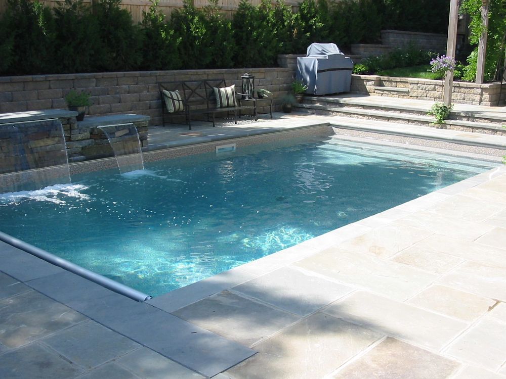 vinyl liner pool with custom water features in Connecticut backyard