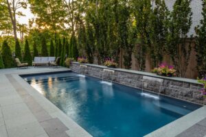 vinyl liner pool with custom water features in Ontario backyard