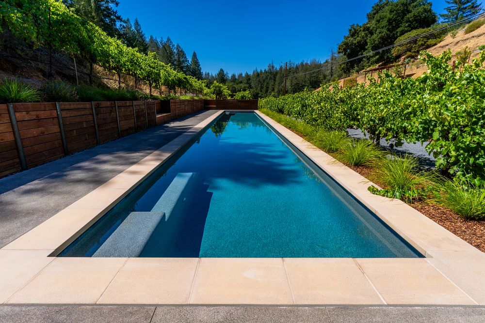 long fiberglass pool for wide rural backyard