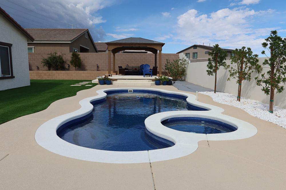 fiberglass pool in a freeform shape in a Nevada suburban backyard