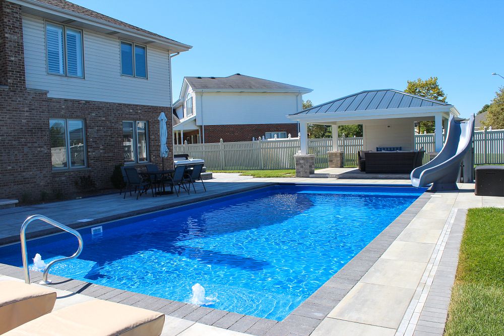 vinyl liner pool with molded leg slide and custom water features